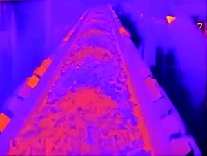 Thermal image of loaded conveyor belt showing material temperature distribution