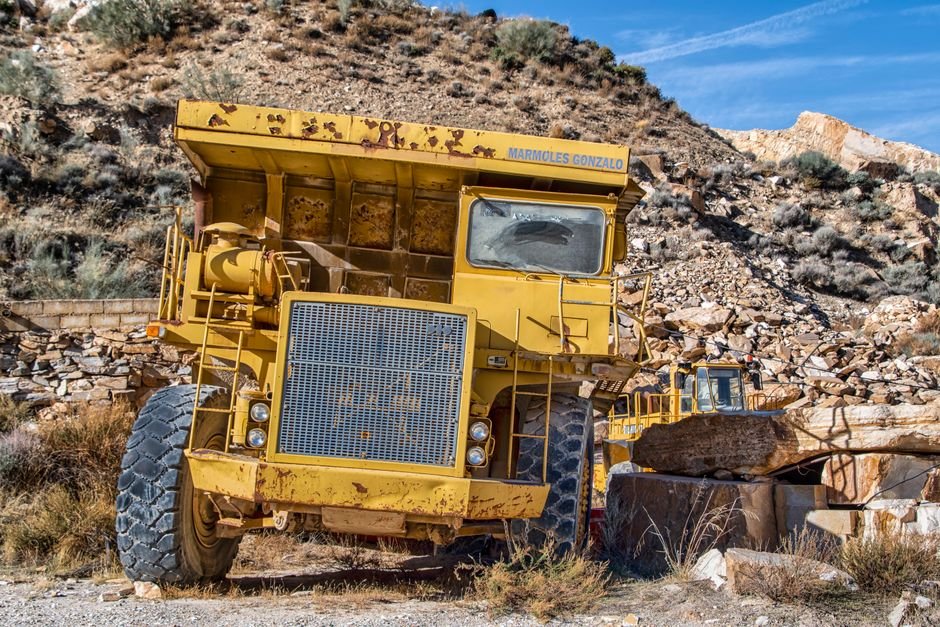 Large haul truck operating in an open-pit mine